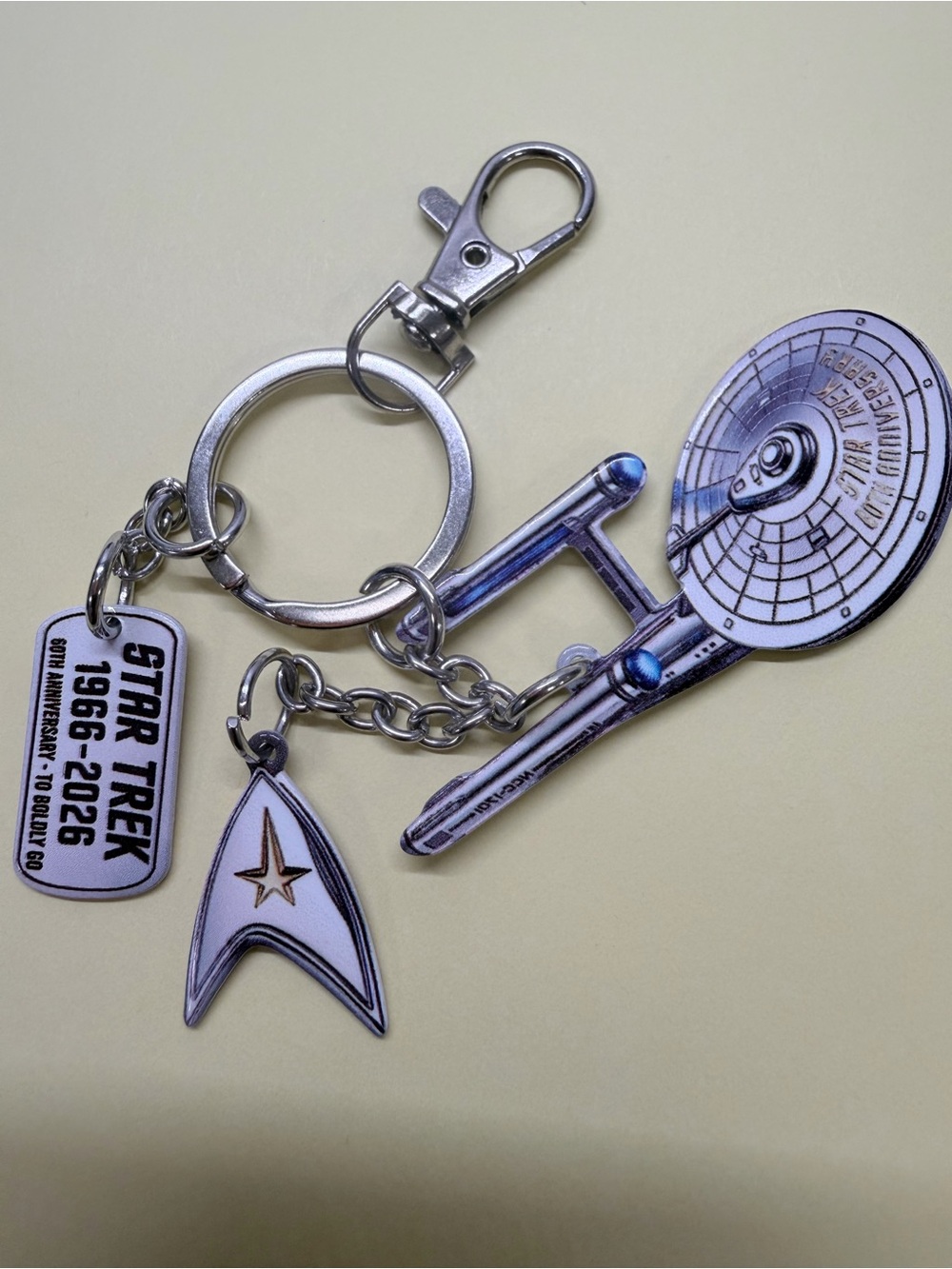 Silver Keychain Set with USS Enterprise and Delta Badge